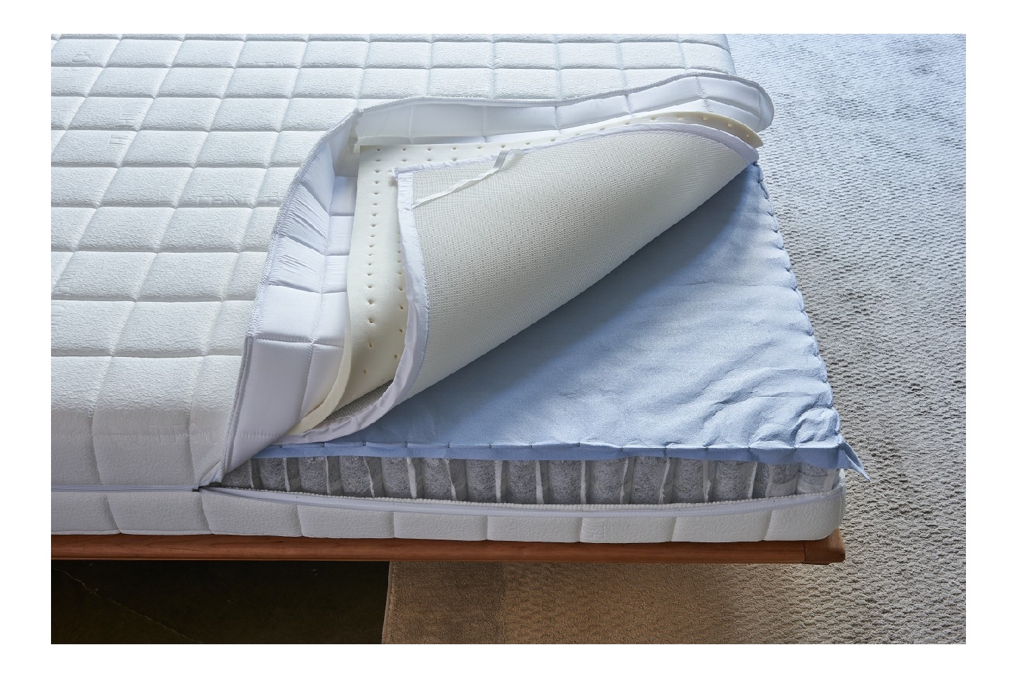 Detailed stitching inspection during commercial mattress factory production